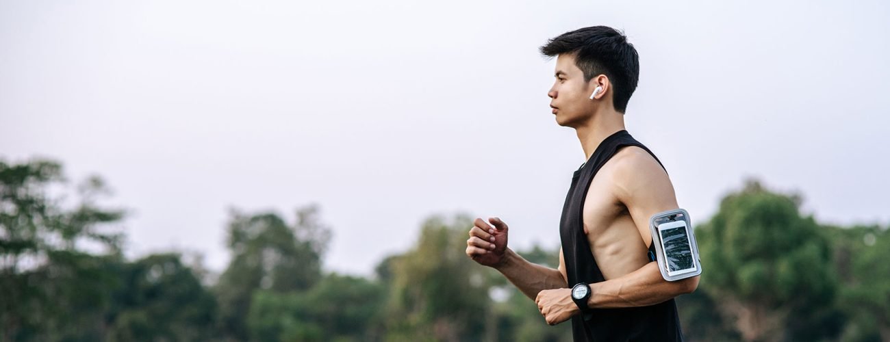 Men and women exercise by running on the road.